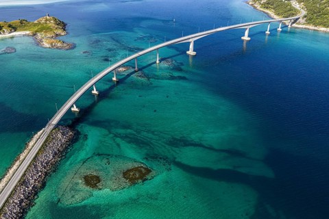 Sommaroy Bridge connecting Kvaloya Island to Sommaroy Island, small islands, turquoise water,