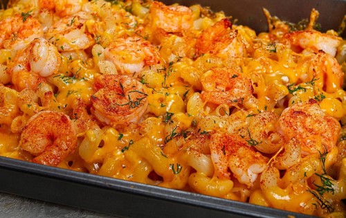 Pasta with shrimp and cheese, with a golden crust, cooked in a baking dish, homemade, no people