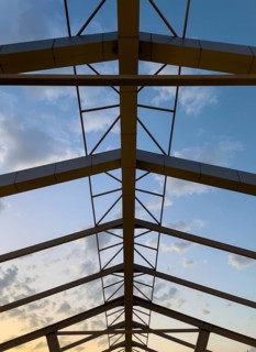 Abstract architecture shapes against a blue sky at sunset