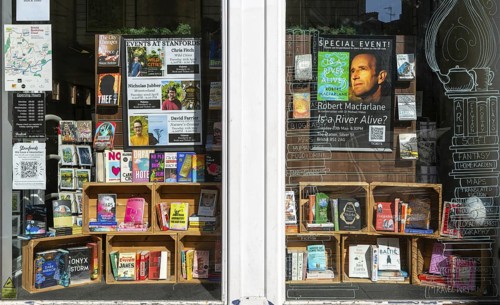 Window display of books and events, Stanfords bookshop, Corn Street, city centre of Bristol,