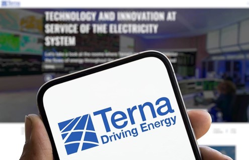 Terna driving energy logo is displayed on smartphone. Terna S.p.A. is a transmission system