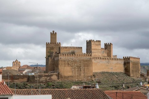 View over rooftops to the Alcazaba of Guadix, Granada, Spain