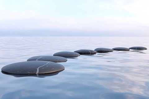 Zen stones in water with reflection, peace meditation relaxation concept