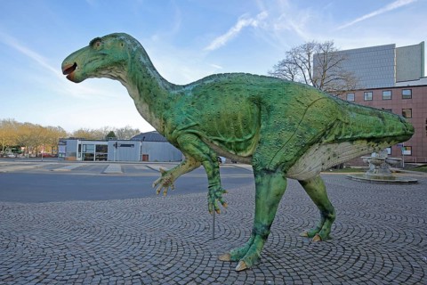 Green Iguanodon dinosaur, realistic model, life-size replica, realistic, animal figure, Natural