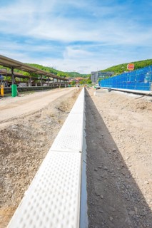 Straight view of construction work on the station area under a blue sky, Leonhard Weiss