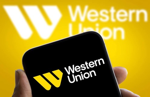 Western union logo is displayed on smartphone. The Western Union Company is an American