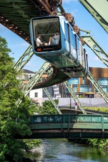 The Wuppertal suspension railway runs above along the Wupper River, between the central railway