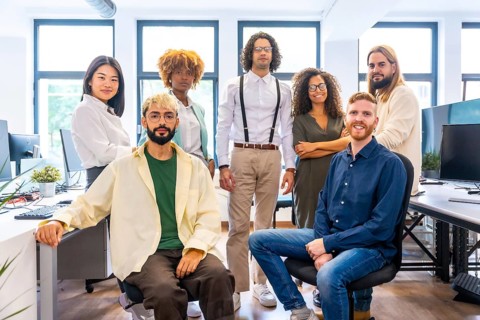 Portrait of a multi-ethnic and young members of a coworking posing together