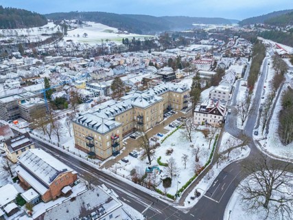 Aerial view of a snow-covered town with surrounding streets and buildings, Nagold, Black Forest,