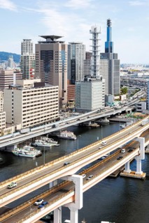 Kobe skyline from above with harbour and elevated roads in Kobe, Japan