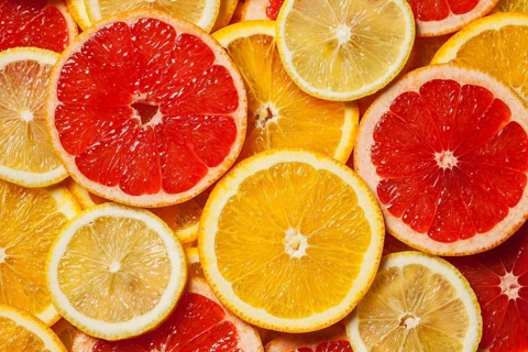Colorful citrus fruit, lemon, orange, grapefruit, slices background