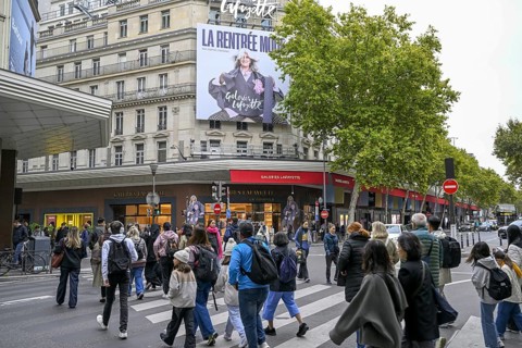 Passers-by in front of Galeries Lafayette, France's most famous department store, Boulevard