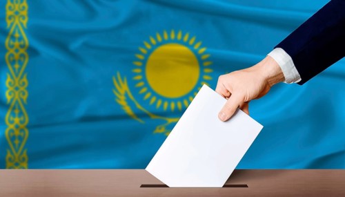 Kazakhstan Parliamentary vote. Hand placing a ballot in ballot box with the Kazakh flag in the