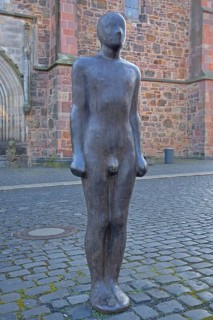 Sculpture Out of the dark by Antony Gormley 1987, dark black naked male figure, darkness, dark,