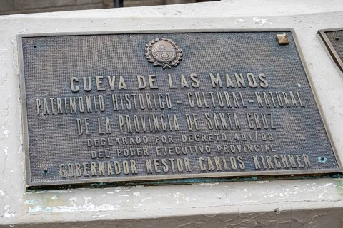 Information sign at the Cueava de las Manos, prehistorical cave painting, historic monument and