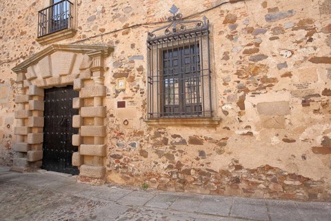 House façade with front door from Palacio de los Condes de Adanero, UNESCO old town, Caceres,