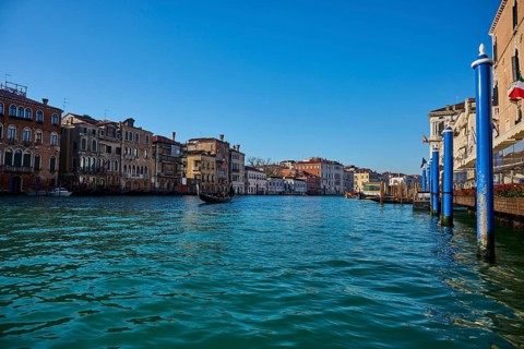 View from a gondola on 'Canal Grande' in Venice on a quiet and sunny morning in winter, Italy