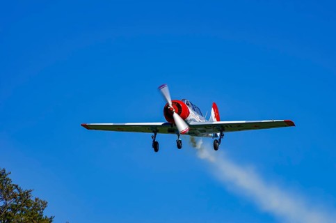 A Jakovlev Jak-52 with registration LY-HLZ during a flight demonstration as part of an air show on