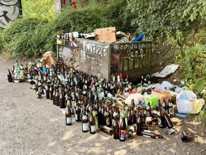 Lots of empty bottles and trash on the Isar, Munich, Germany
