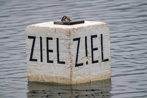 Target buoy on a lake, marker buoy for water sports, regattas, rowing, canoeing, kayaking, symbolic