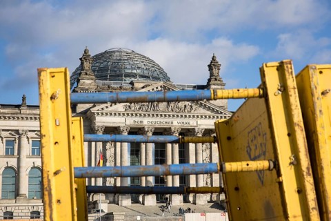 Reichstag building in Berlin Mitte behind wall formwork due to construction work on the Platz der