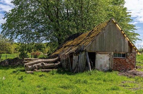 Abandoned and derelict farmhouses on undeveloped land in Rügen, Mecklenburg-Vorpommern, Germany