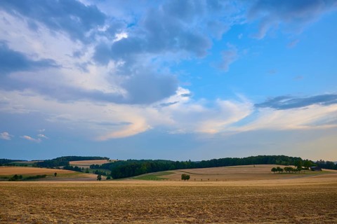 Open fields under a wide, strong sky with a summer atmosphere, summer, Reichartshausen, Amorbach,