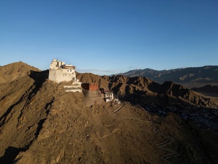 Captivating view of Leh Palace in Leh Ladakh, India, perched atop a rugged hill with a backdrop of