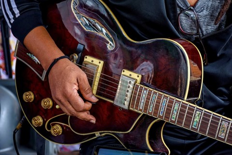 Electric guitar player performing on stage at a music show Belo Horizonte, Minas Gerais, Brazil