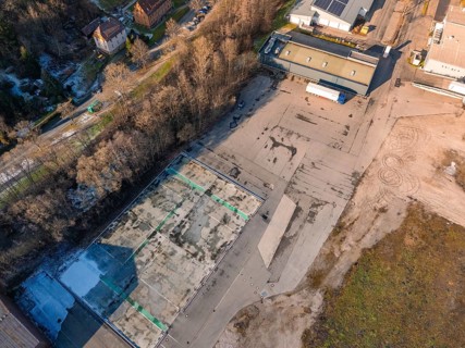 Aerial view of a factory site surrounded by trees in wintry surroundings, Nagold, Black Forest,