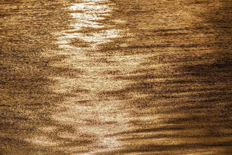 Sun rays are reflected on the sea surface, small waves, Baltic Sea