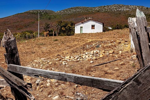 Lonely hut on a hill in a deserted and arid landscape, settlement and villages in the Caatinga of