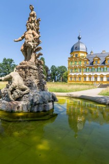 Park view of Seehof Castle with reflection in a water basin of the cascade, Hercules Group by