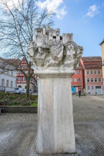 Sandstone fountain by the Kitzingen artist Klaus Christof, depicting the heavenly Jerusalem, in