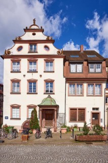Former council chancellery, a gabled house against a blue sky with cumulus clouds in Gengenbach,