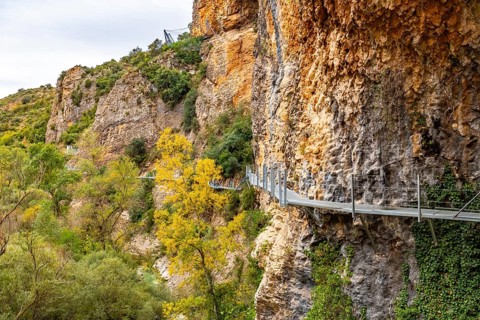 Metal walkways on the wall of the path next to the Vero River in Alquezar. Pyrenees