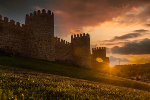 Avila city wall one afternoon with a beautiful sunset, Spain