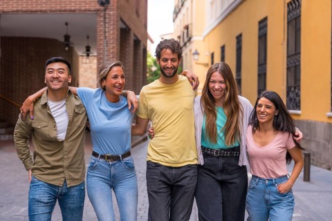 Multiracial best friends having fun in the city, friendship concept with guys and girls hanging out