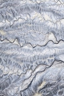 Captivating aerial shot of the intricate, textured landscape of Moonscape Overlook in Utah,
