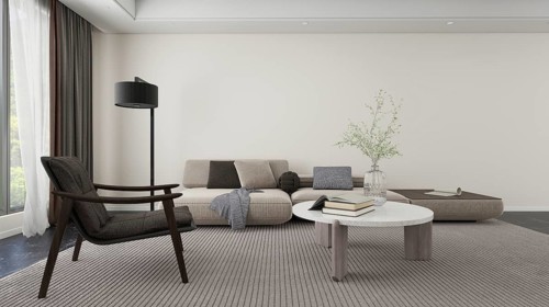 Cozy, modern living room featuring a neutral color palette. Includes a comfortable sofa, elegant