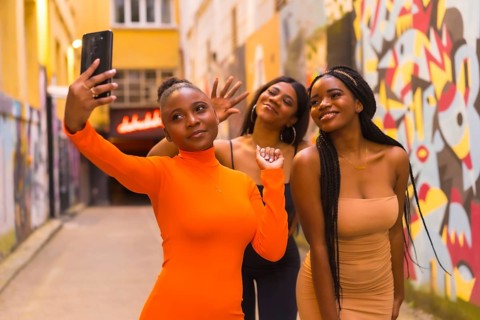 San Sebastián, Gipuzkoa Spain, February 2021: Three girls taking a selfie. Fashionable urban style