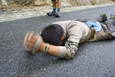 A man bowing around a legendary mountain