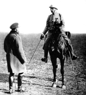 World War I. Following a review near Compiègne, King George V of England congratulates a French general  (1915)