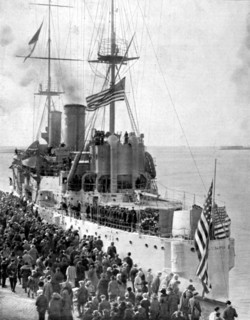 The cruiser "Olympia", carrying the body of an unknown American soldier, killed on a French battlefield during World War I, casting off from Le Havre (1921)