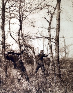 World War I. A dragoon on reconnaissance, photographed just as he is shot in the shoulder