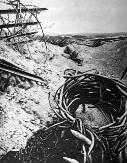 World War I. A French officer examining enemy  lines  from a crater in Champagne (1915)