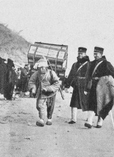 Korea : ; Japanese officers with a Korean porter