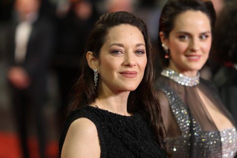 Noémie Merlant (in custom Louis Vuitton) and Marion Cotillard (in custom Chanel) attend the "Roma