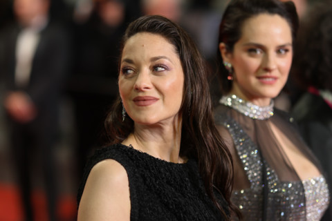 Noémie Merlant (in custom Louis Vuitton) and Marion Cotillard (in custom Chanel) attend the "Roma