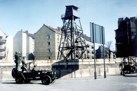 American soldiers patrolling in front of the Berlin wall
